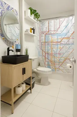 a bathroom with a toilet and a sink and a mirror at Tropical style room in Geusthouse in New York