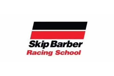 a sign for a skip barber racing school at Walk to the Outfield of Lime Rock Park in Salisbury