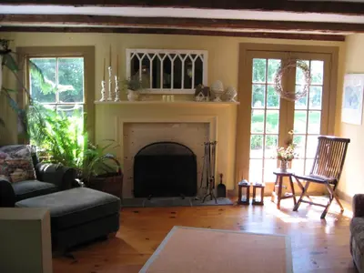 a living room with a couch and a fireplace at B&B on seven acres with private bed & bath in Clinton Corners