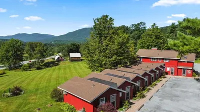 an aerial view of a red barn with a yard at North Shire Lodge in Manchester