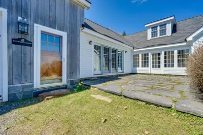 a home with a gray house with a yard at Serene Retreat Near Mt Snow Great for Groups! in Marlboro