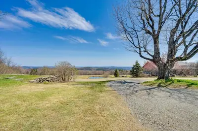a tree on the side of a gravel road at Serene Retreat Near Mt Snow Great for Groups! in Marlboro