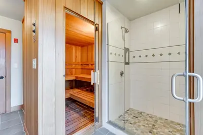 a bathroom with a shower and a walk in closet at Wellness Retreat with Views! Upscale Marlboro Cabin in Marlboro