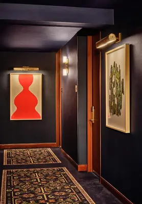 a hallway with a door and a painting on the wall at Romer Hell's Kitchen in New York