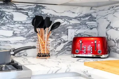 a kitchen counter with a red toaster and utensils at 13-3 I Brand New 4BR 3 Baths Duplex Private Roof Deck in New York