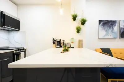 a kitchen with a white counter top in a room at 1597-9 Renovated Studio Prime UES WD in unit in New York