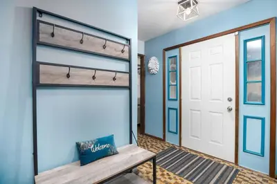 a room with a bench in front of a door at Breathtaking views. Hot tub. Huge Deck. Fast Wifi in Andes