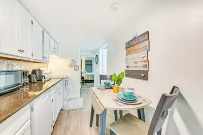 a kitchen with a small table and chairs in a room at Walk to Downtown Albany Ten Broeck Triangle Apt! in Albany