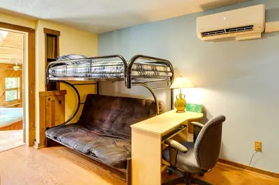 a room with a desk and a bunk bed at Spacious Woodbury Home with Pool and Hot Tub! in Woodbury