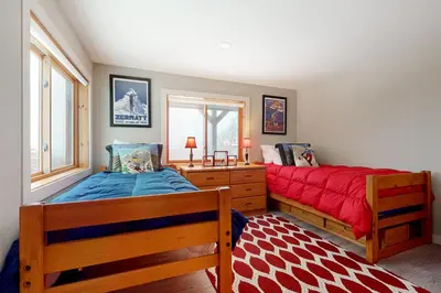 a bedroom with two beds and a window at Mountain View Chalet in West Dover