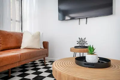 a living room with a couch and a coffee table at 91-1D 3BR 2baths Duplex with a Private Back yard - GYM in New York
