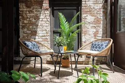 two chairs and a table on a patio at 91-1D 3BR 2baths Duplex with a Private Back yard - GYM in New York