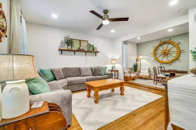 a living room with a couch and a table at Hot Tub and Lake Access at Poconos Getaway! in Lake Ariel