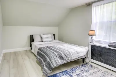 a small bedroom with a bed and a window at Jersey City Vacation Rental about 8 Mi to NYC! in Jersey City
