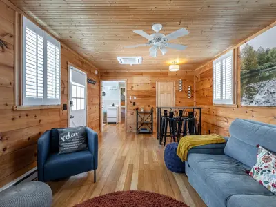 a living room with a couch and a ceiling fan at Cozy 2-bedroom Cottage with Access to Bantam Lake in Morris