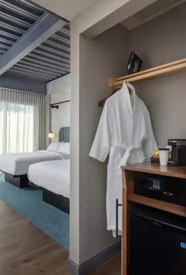a hotel room with two beds and a bedroom with at voco James Newbury Hudson Valley by IHG in Coxsackie
