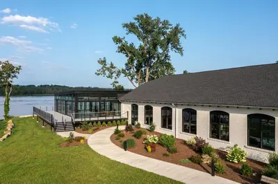 a large house with a large building with a garden at voco James Newbury Hudson Valley by IHG in Coxsackie