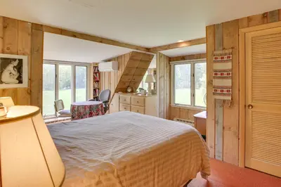 a bedroom with a bed in a room with windows at Serene Salisbury Rental Home on 26 Acres with Deck! in Salisbury