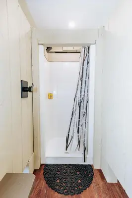 an open door with a rug in a hallway at Battenkill Glamping Resort in Cambridge
