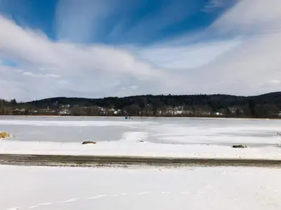 a frozen lake with snow on the ground at Silver Lake Cabin w/ Own Lake! (near Cooperstown) in New Berlin