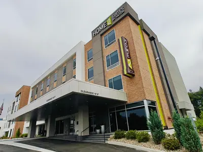 a hotel building with a sign on the side of it at Home2 Suites By Hilton Bristol in Bristol