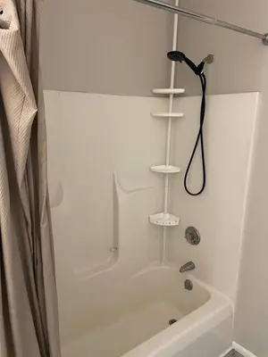a white bathroom with a shower and a bath tub at Private Apartment in Southbury 101 in Southbury