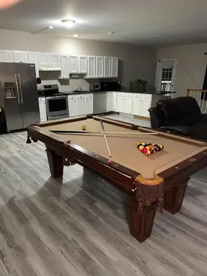 a kitchen with a pool table in a living room at Private Apartment in Southbury 101 in Southbury