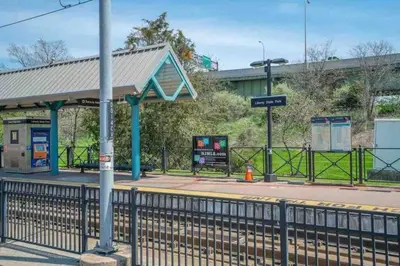 a train station with a platform with a train at Liberty Dream - 20 min to NYC in Jersey City