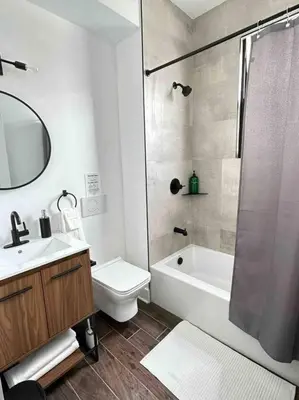 a bathroom with a sink and a toilet and a shower at Secret Escape - 20 min from NYC N 2 in Jersey City