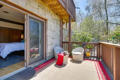 a balcony of a house with a bed and a glass door at East Fishkill Escape, Close to Red Wing Park! in Hopewell Junction