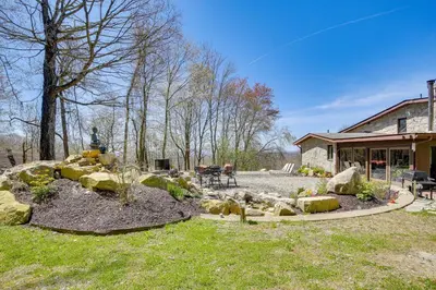 a backyard with a garden with rocks and a house at East Fishkill Escape, Close to Red Wing Park! in Hopewell Junction