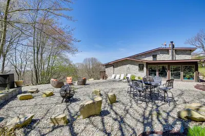 a patio with chairs and a table in front of a building at East Fishkill Escape, Close to Red Wing Park! in Hopewell Junction