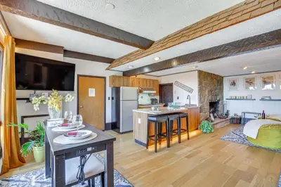 a large kitchen and living room with wooden floors at East Fishkill Escape, Close to Red Wing Park! in Hopewell Junction