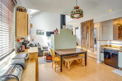 a kitchen and living room with a table and chairs at Windham Mountain Vacation Rental about 3 Mi to Lifts! in Windham