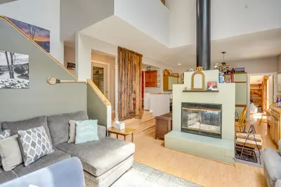 a living room with a couch and a fireplace at Windham Mountain Vacation Rental about 3 Mi to Lifts! in Windham