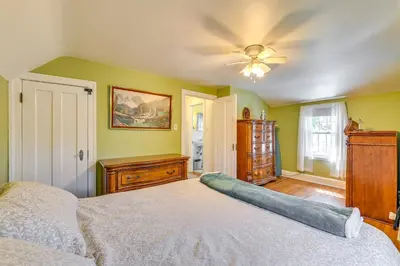 a bedroom with a bed and a ceiling fan at Pet-Friendly Gloversville Cottage Near Golf Course in Gloversville