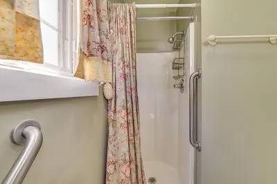 a shower with a shower curtain and a window at Pet-Friendly Gloversville Cottage Near Golf Course in Gloversville