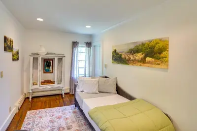 a bedroom with a bed and a painting on the wall at Family Ski Getaway 6 Mi to Berkshire East! in Hawley