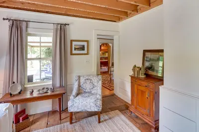 a living room with a desk and a chair at Family Ski Getaway 6 Mi to Berkshire East! in Hawley