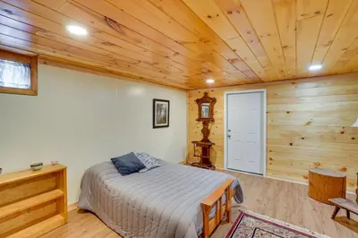 a bedroom with a bed and a wooden ceiling at Massachusetts Vacation Rental with Deck and Grill in Cheshire
