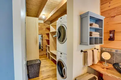 a laundry room with a washer and dryer at Massachusetts Vacation Rental with Deck and Grill in Cheshire