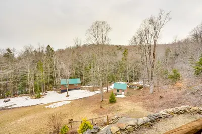 an aerial view of a cabin in the woods at Massachusetts Vacation Rental with Deck and Grill in Cheshire