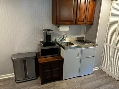 a small kitchen with a sink and a coffee maker at Mid-Century DJs Dream near Rhinebeck in Staatsburg