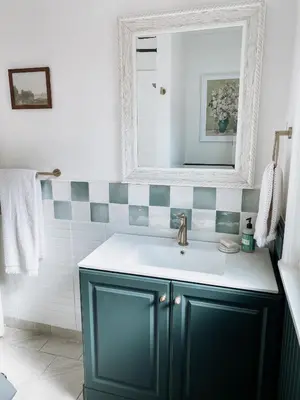 a bathroom with a green sink and a mirror at Designer Home 2 Bedroom - 20min to NYC WTC - Private Backyard in Harrison