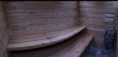 a wooden sauna with a bench in a room at The country house in Greenwood Lake