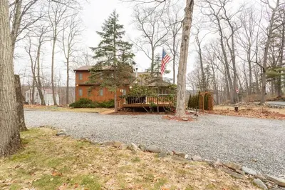 a house with an american flag in front of it at The country house in Greenwood Lake