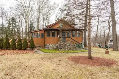 a small house in the middle of a yard at The country house in Greenwood Lake
