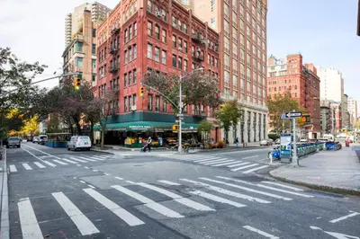 an empty street with a crosswalk in a city at Tribeca Studio w Pool Roofdeck Gym View NYC-273 in New York