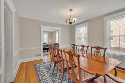 a dining room with a wooden table and chairs at Charming New England Home in West Hartford Center in West Hartford