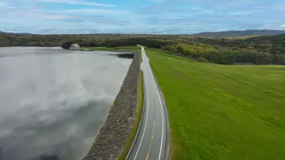 an aerial view of a road next to a river at The Tannery House in Claryville
